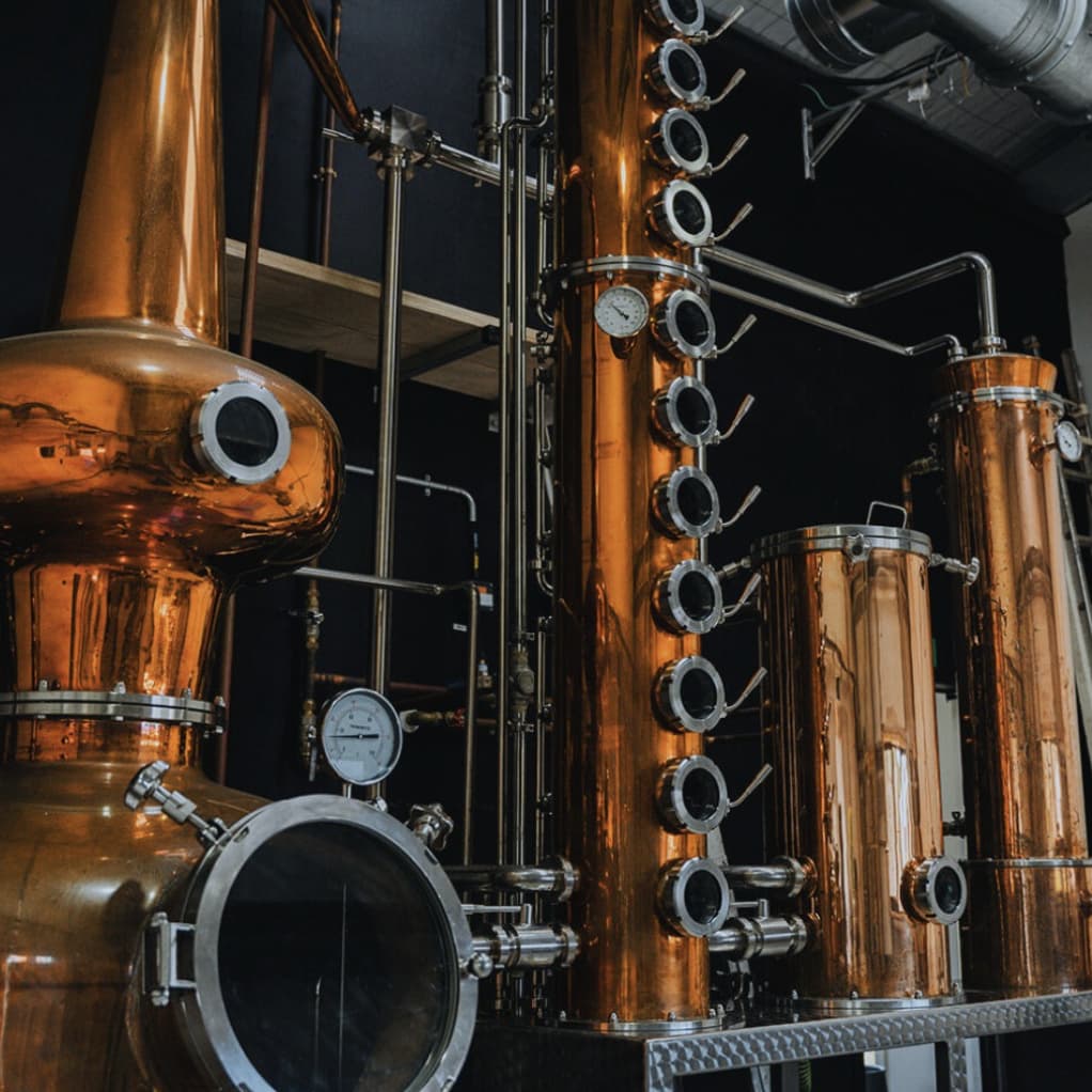 Copper distilling equipment inside the distillery